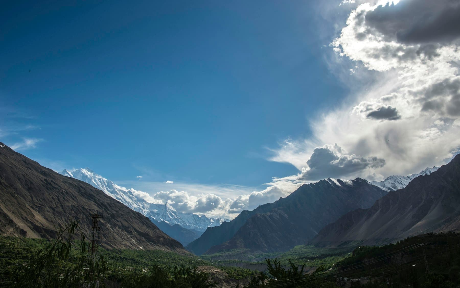 A road through green mountain valleys