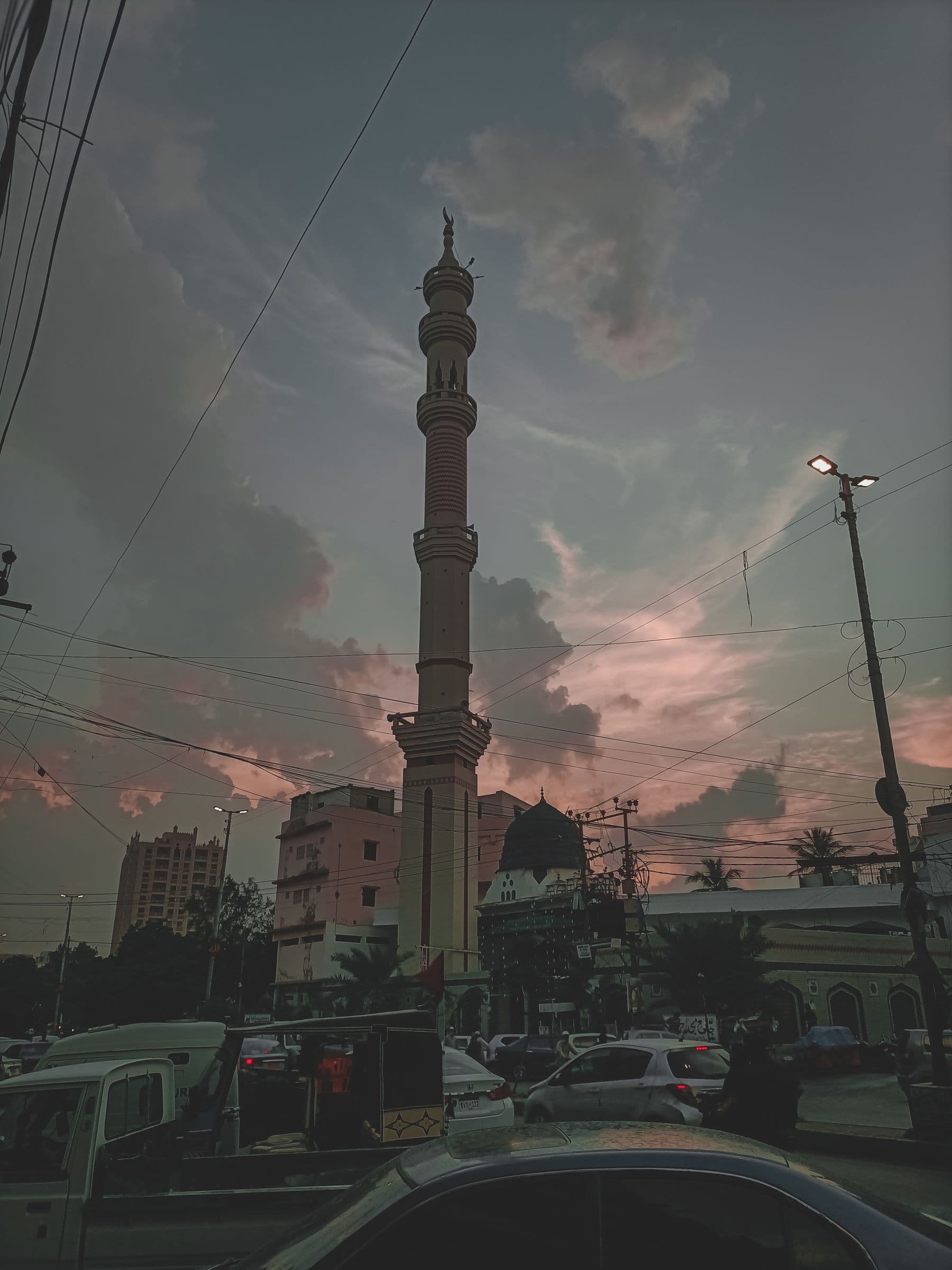 Karachi skyline and mosque minaret at sunset