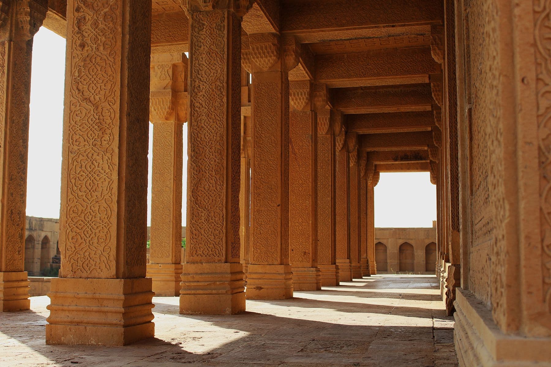Intricately carved sandstone corridor at Makli Necropolis